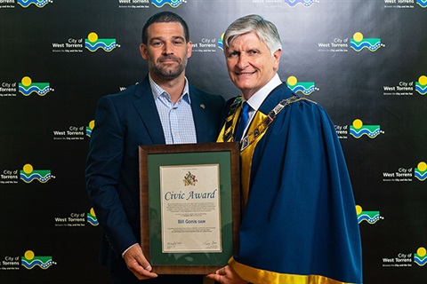 West-Torrens-Civic-Award-Peter-Gonis-accepts-the-award-for-his-late-father-Bill-from-Mayor-Coxon.jpg