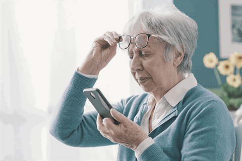 Woman-with-glasses-and-phone---eyes.gif